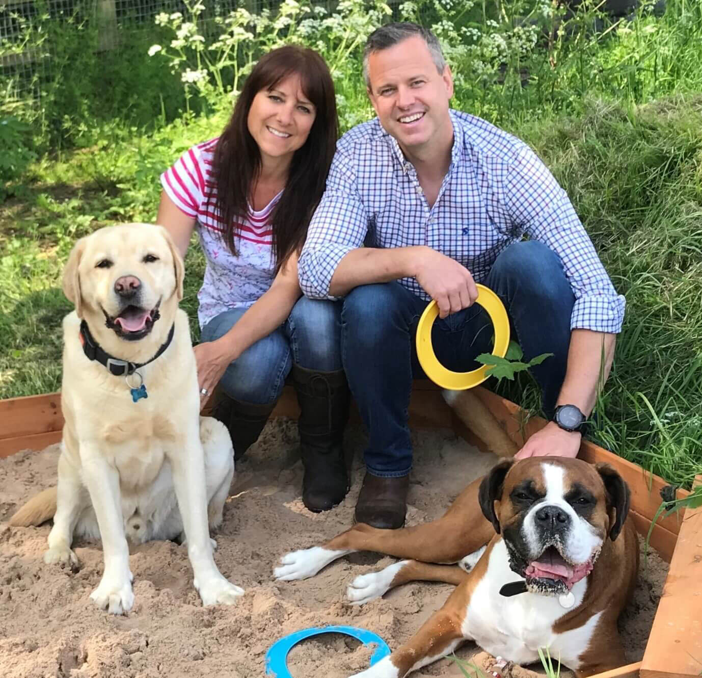 Photo of Scott, Karen and dogs at the Green Meadow Dog Day Care site