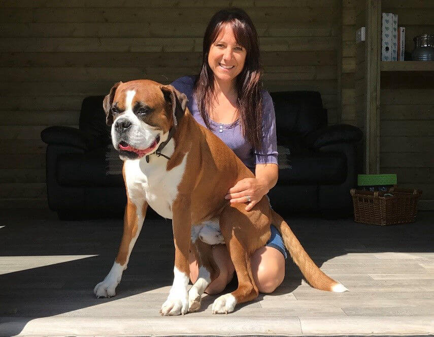 Photo of owner Karen with her dog Oscar at Green Meadow Dog Day Care